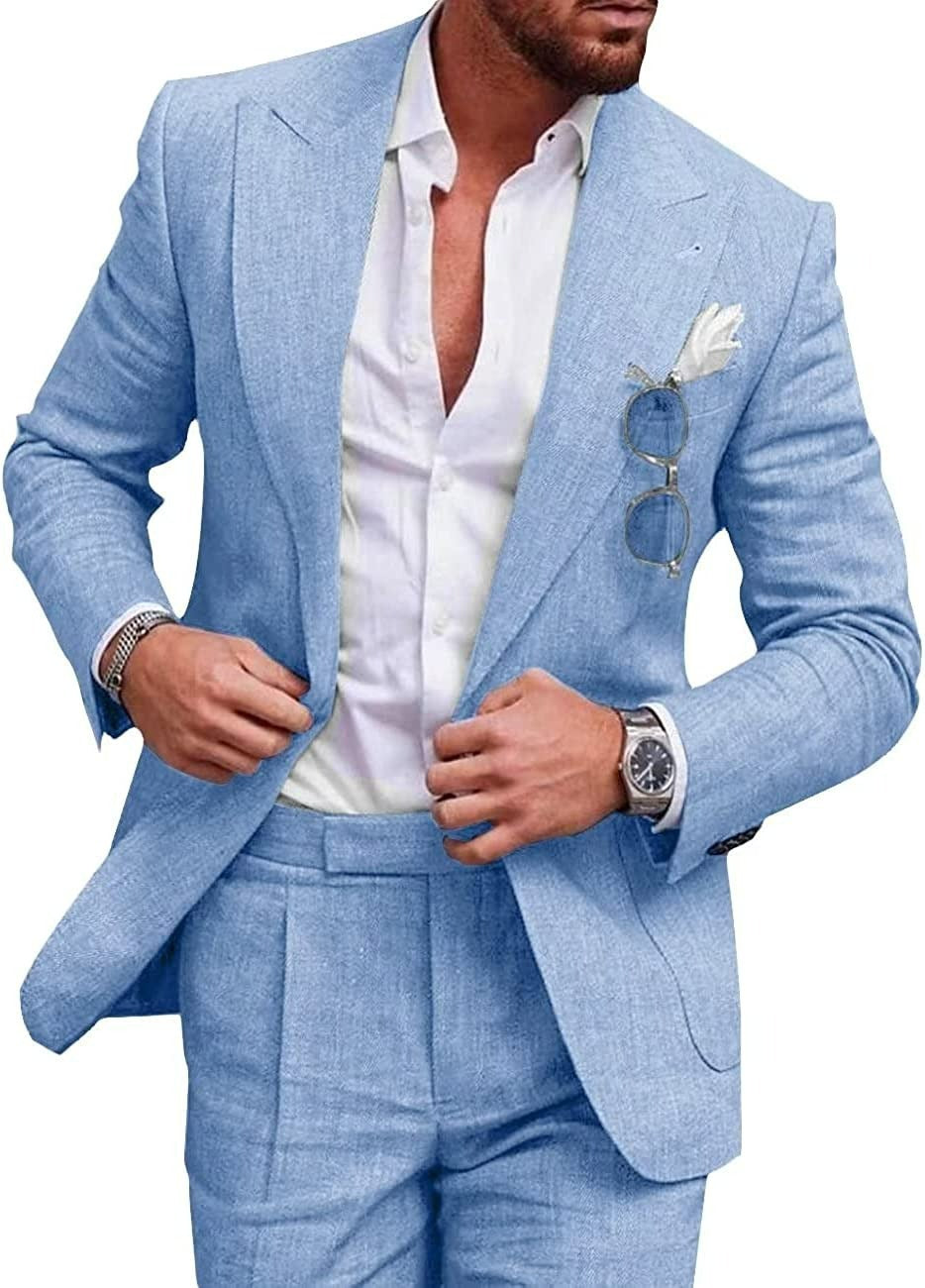 Man wearing a light blue suit with a white shirt on a white background