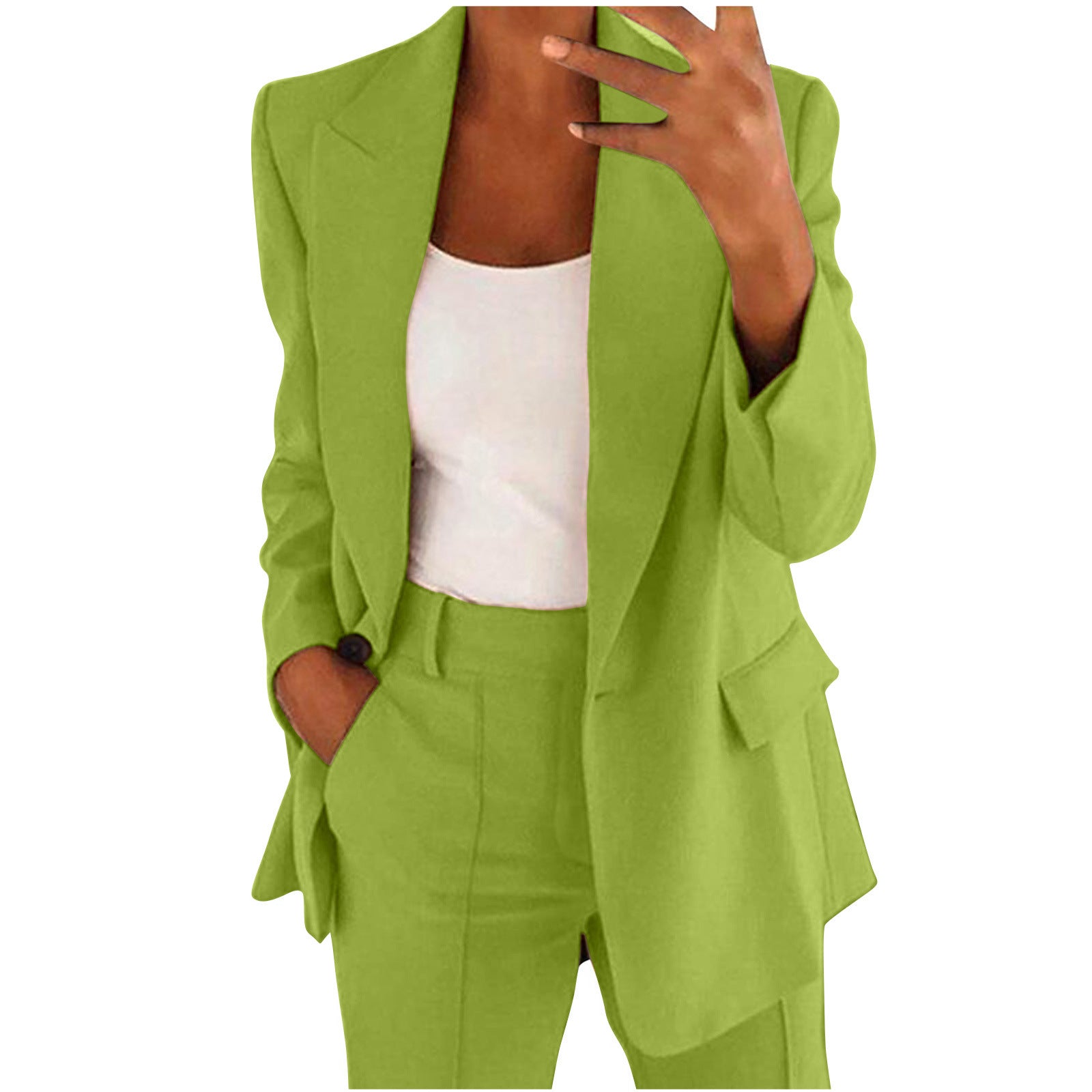 Person wearing a green suit with a white top on a white background