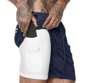 Person wearing navy and white athletic shorts with a black waistband.