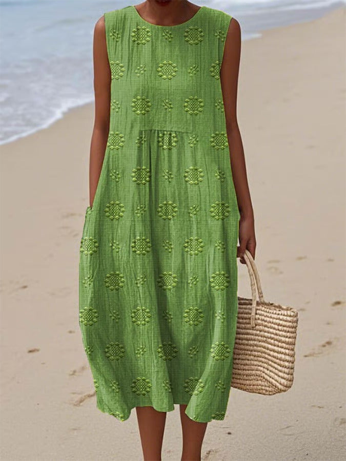 Person wearing a green dress on a beach