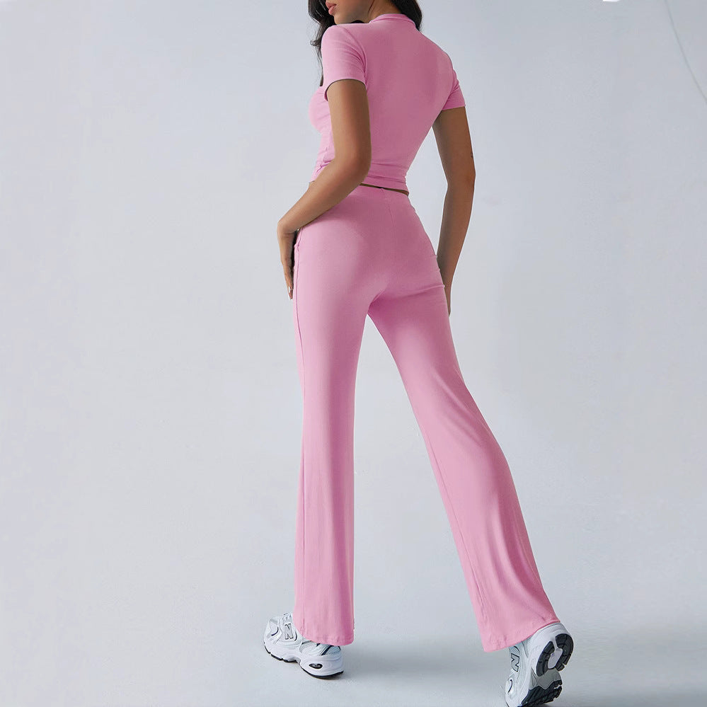 Person wearing a pink athletic outfit on a light gray background