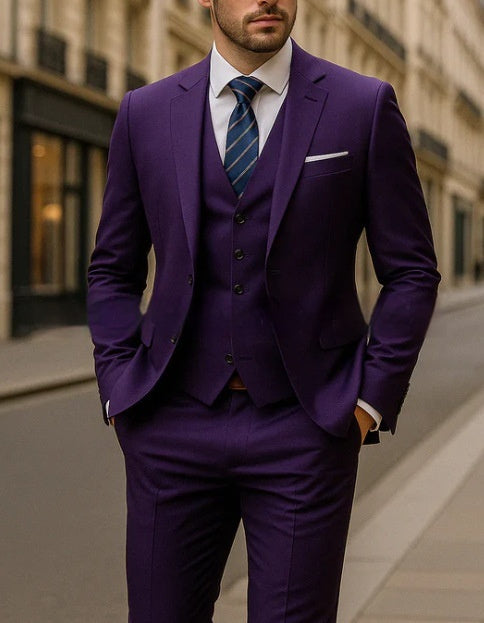 Man wearing a purple suit with a blue striped tie in an urban setting