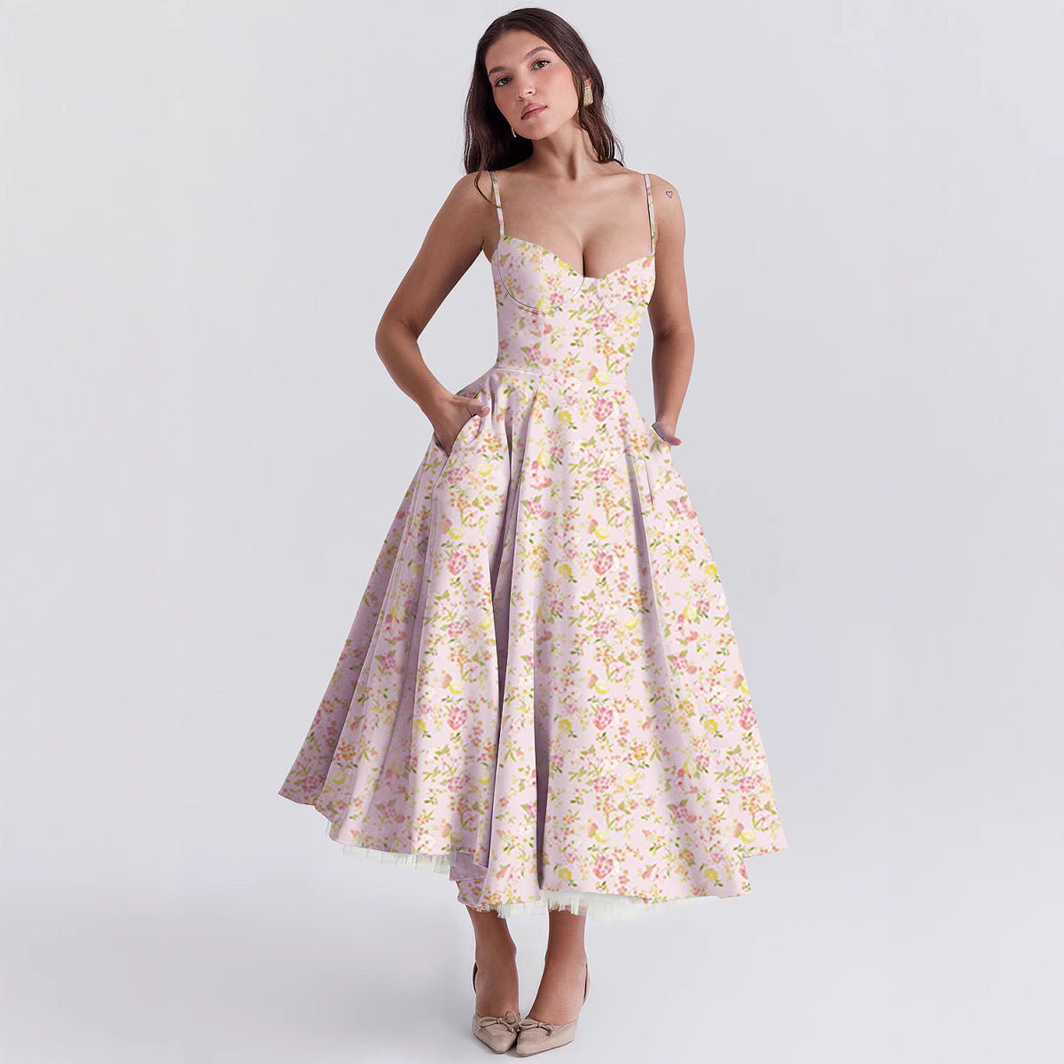 Woman wearing a floral dress on a light gray background