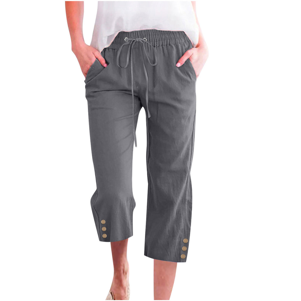Gray capri pants worn by a person on a white background