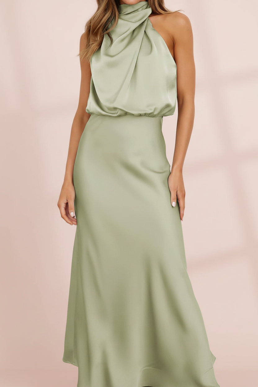 Sage green halter neck dress on a white background