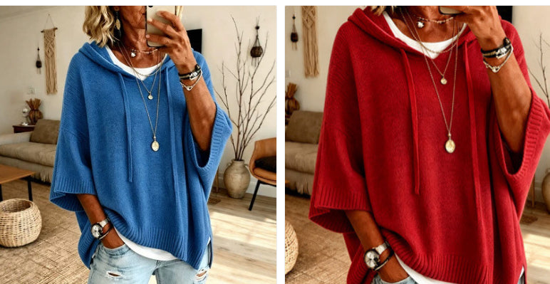 A side-by-side comparison of a woman wearing two different colored hooded poncho sweaters. The left image shows a medium blue poncho, and the right image shows a deep red poncho.