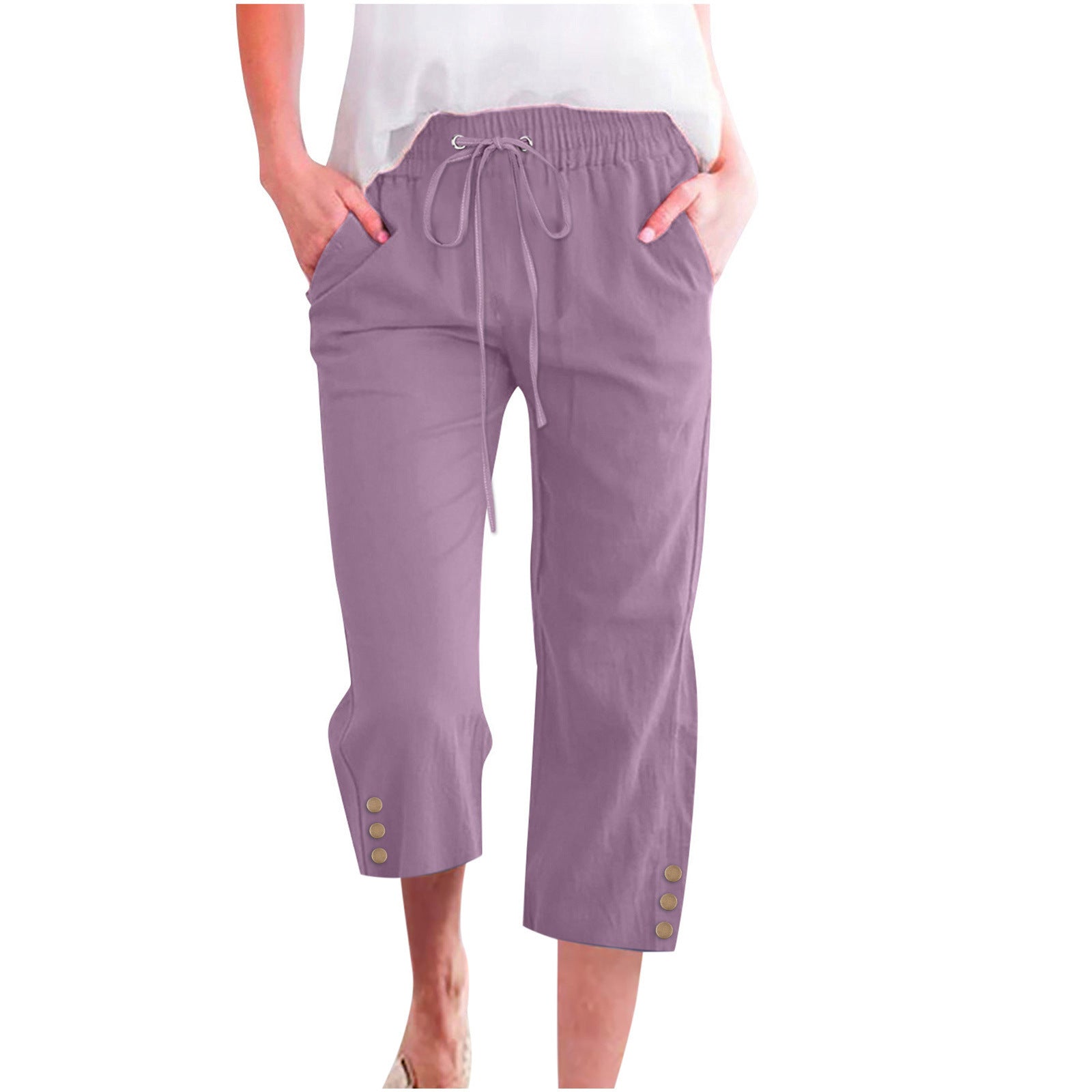 Purple capri pants worn by a person on a white background