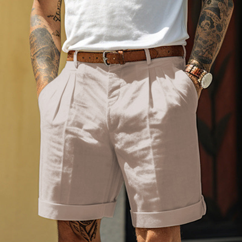 Person wearing light-colored shorts with a blurred background