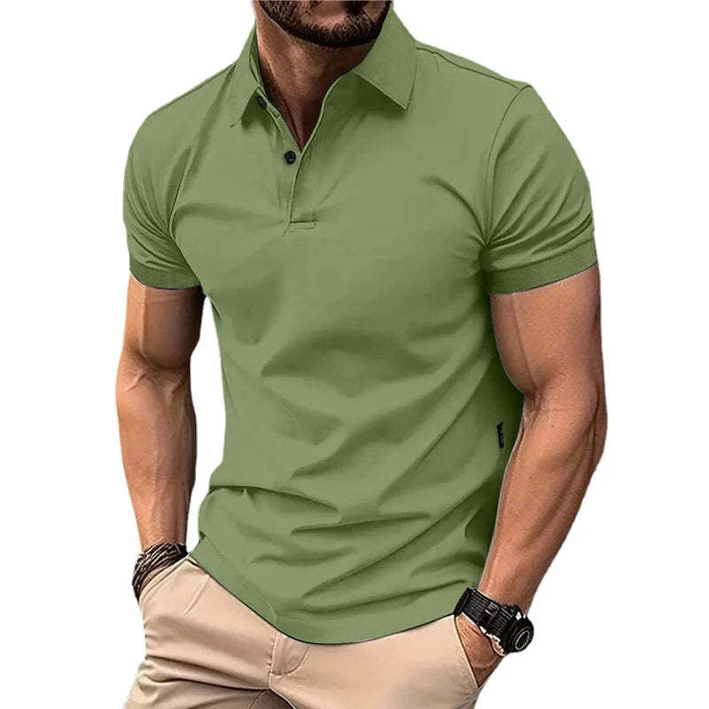 Man wearing a green polo shirt and beige pants on a white background