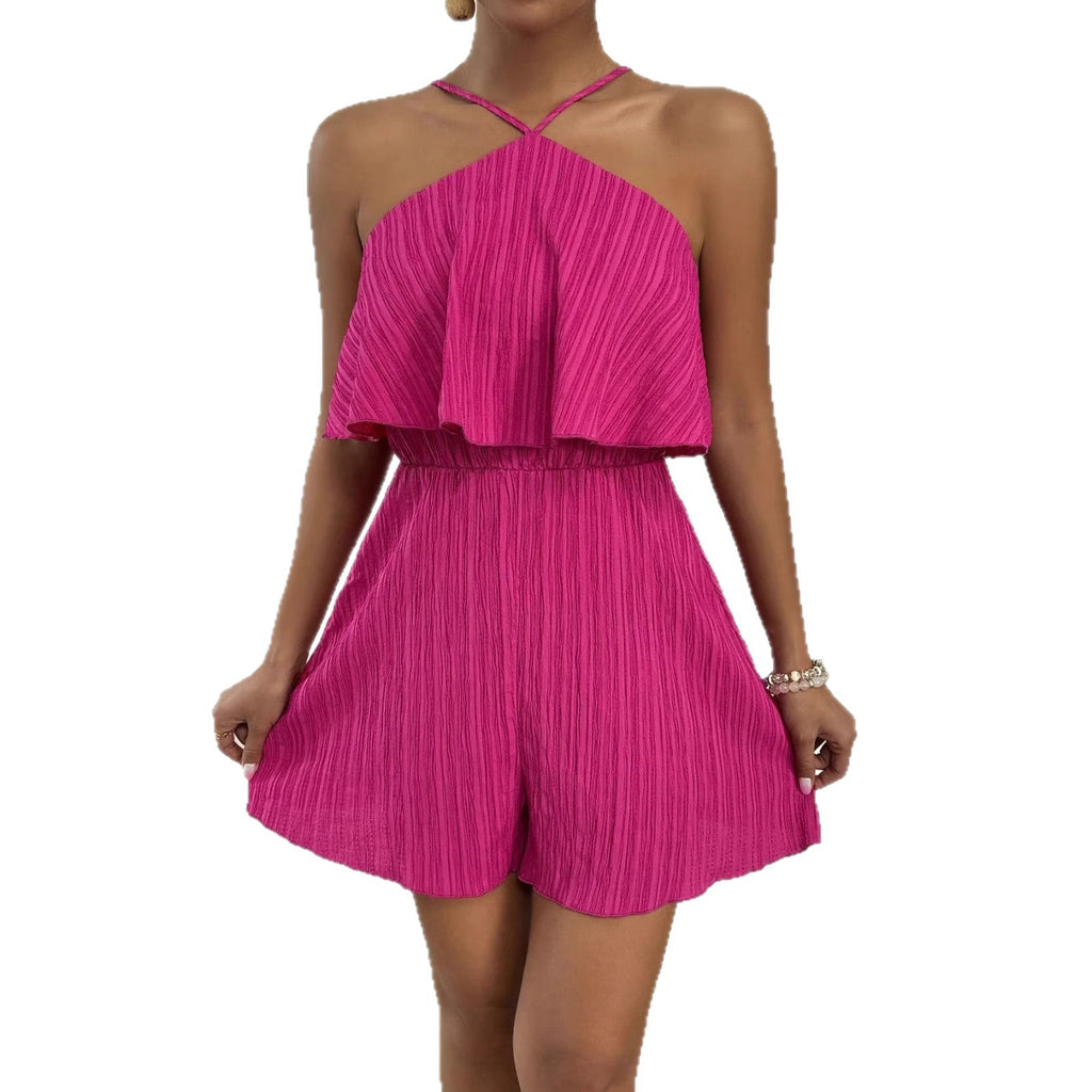Woman wearing a bright pink pleated dress on a white background