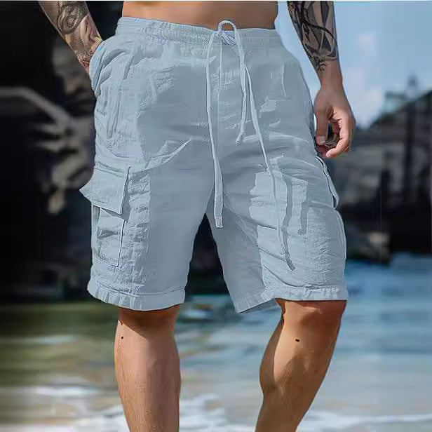 Person wearing light gray cargo shorts on a beach