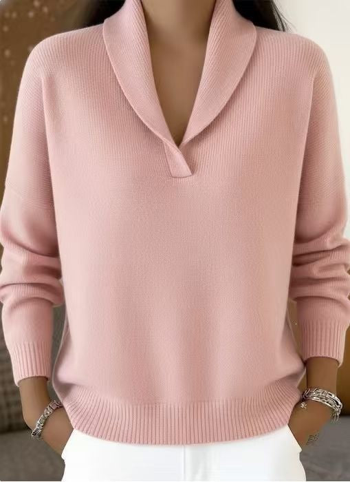 Pink sweater worn by a mannequin against a neutral background
