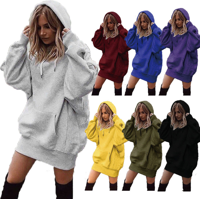 Woman wearing a gray hoodie with color options displayed in a grid.