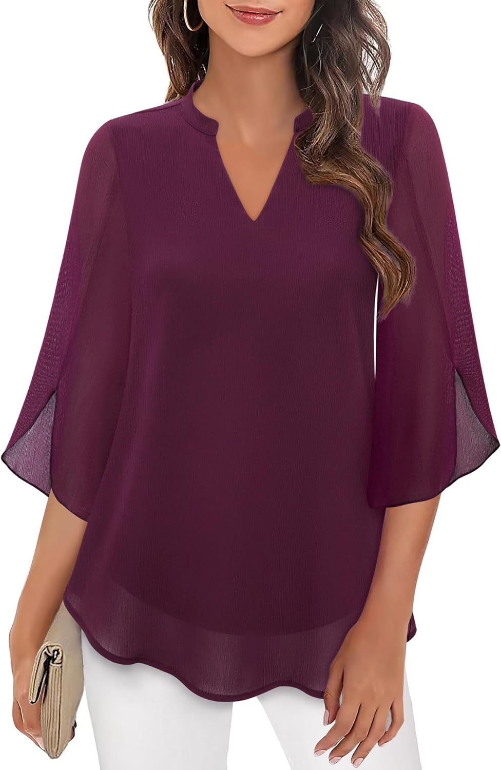 Purple blouse with sheer sleeves worn by a model on a white background