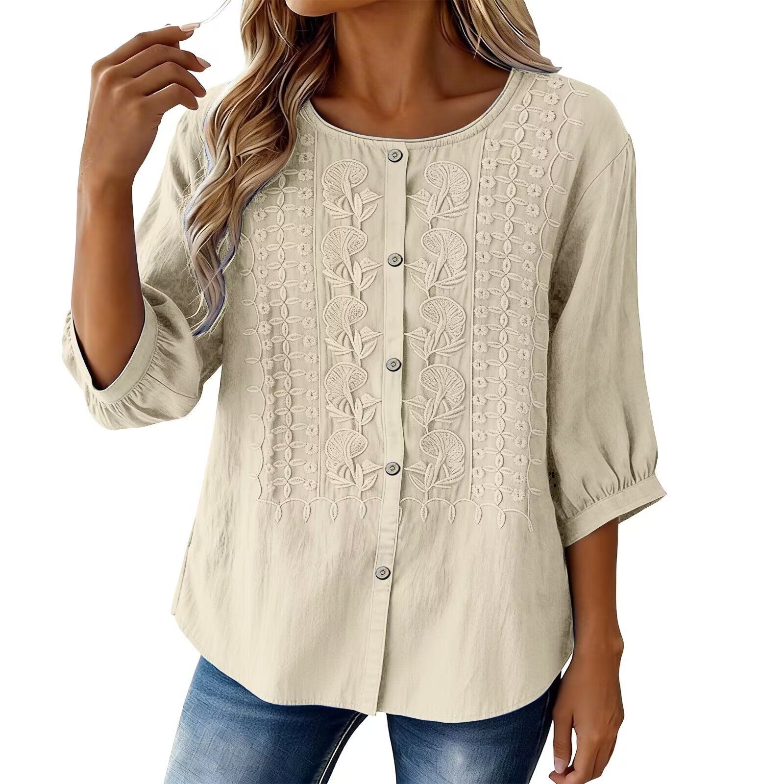 Beige blouse with lace details worn by a model on a white background
