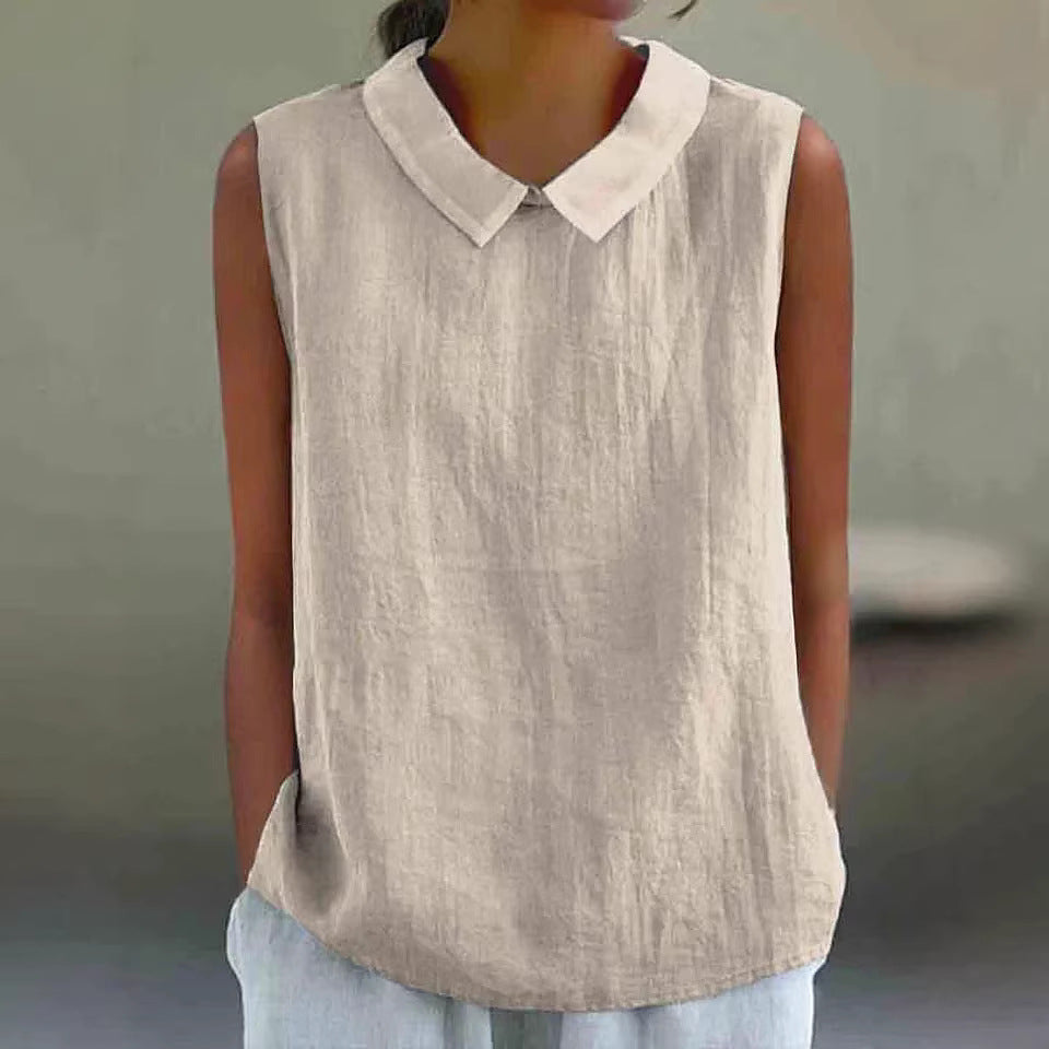 Beige sleeveless top with a white collar worn by a person against a neutral background