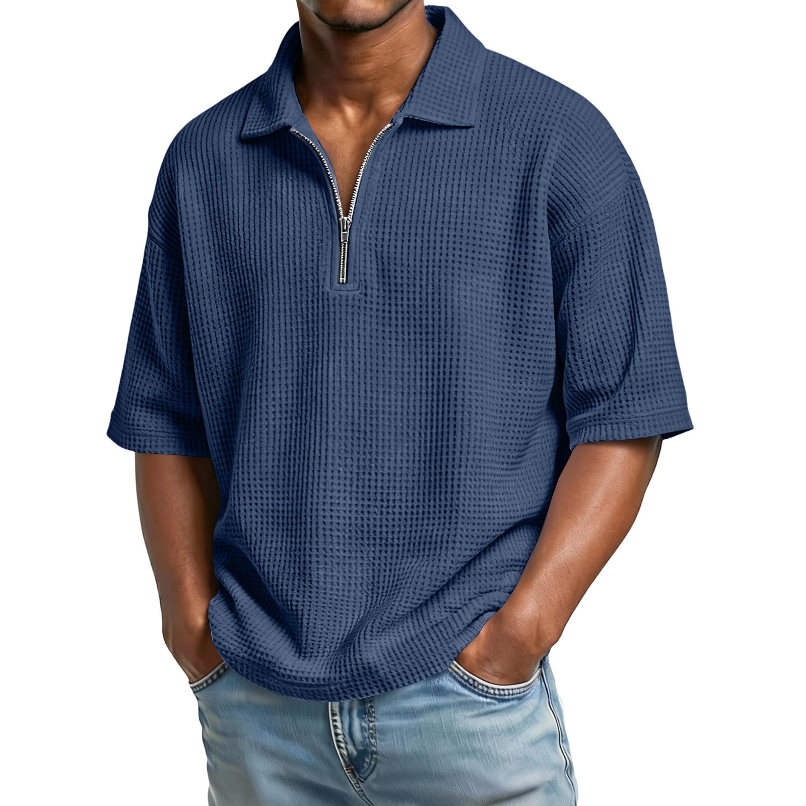 Man wearing a blue textured short-sleeve shirt with a zipper on a white background