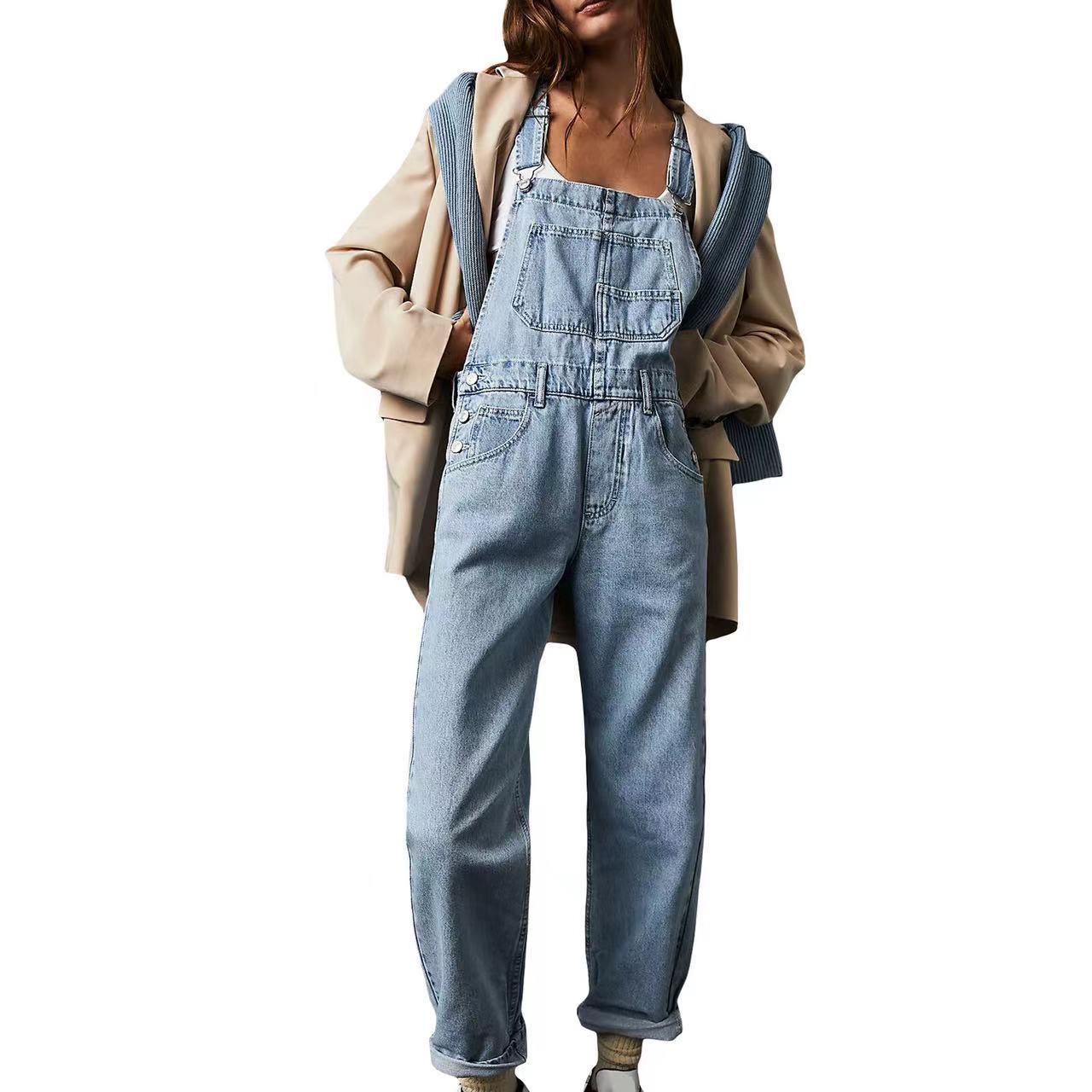 Person wearing a denim overalls with a beige jacket on a white background