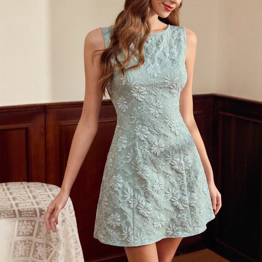Light blue lace dress worn by a model indoors.