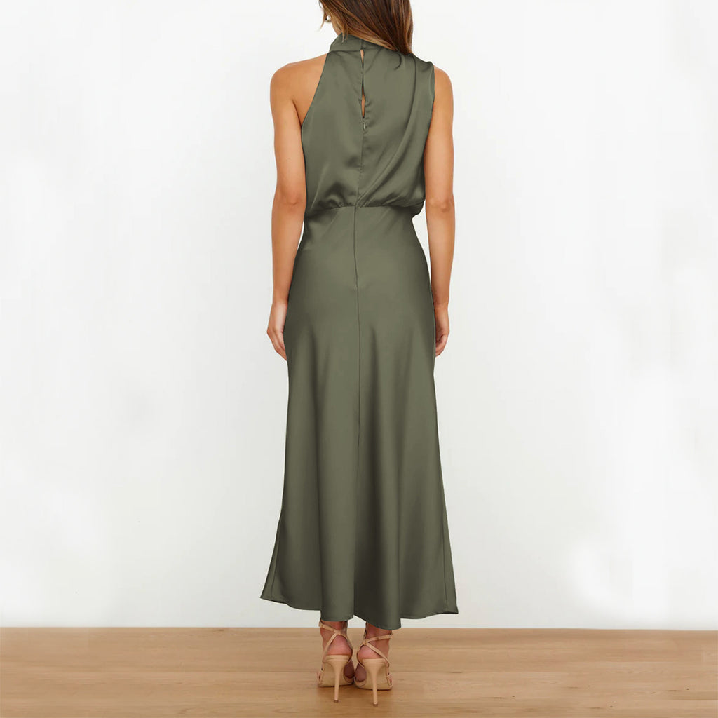 Woman wearing a green dress against a white background