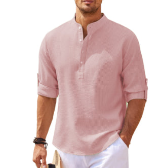 Man wearing a pink textured shirt on a white background
