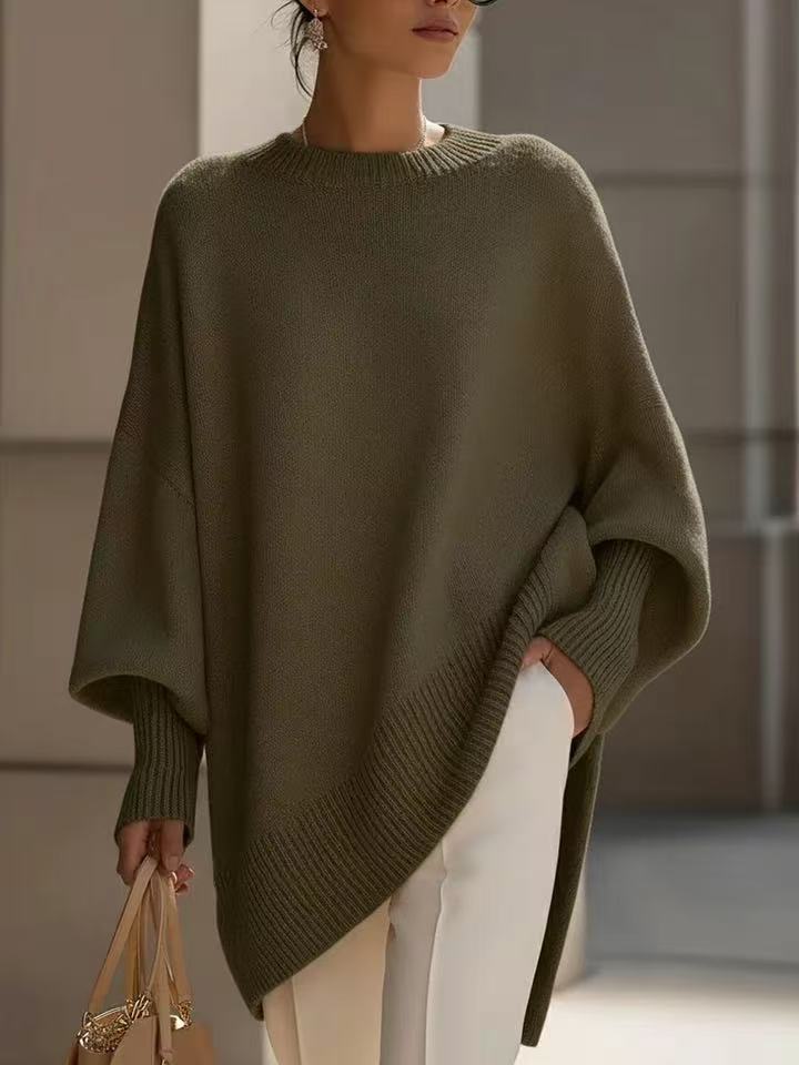 Person wearing a green poncho with a blurred background
