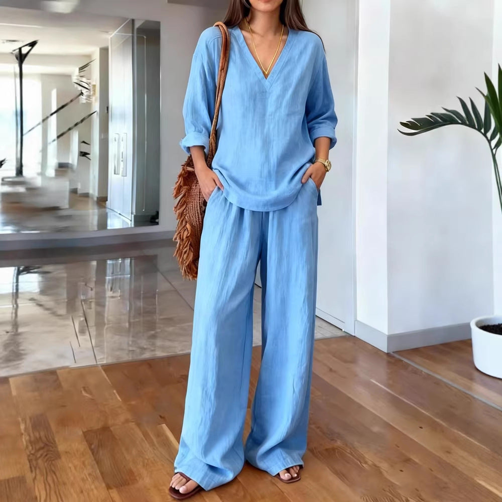 Person wearing a blue outfit in a modern indoor setting