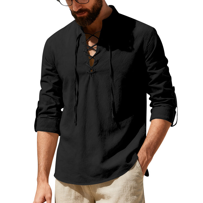 Man wearing a black long-sleeve shirt with lace-up front design on a white background