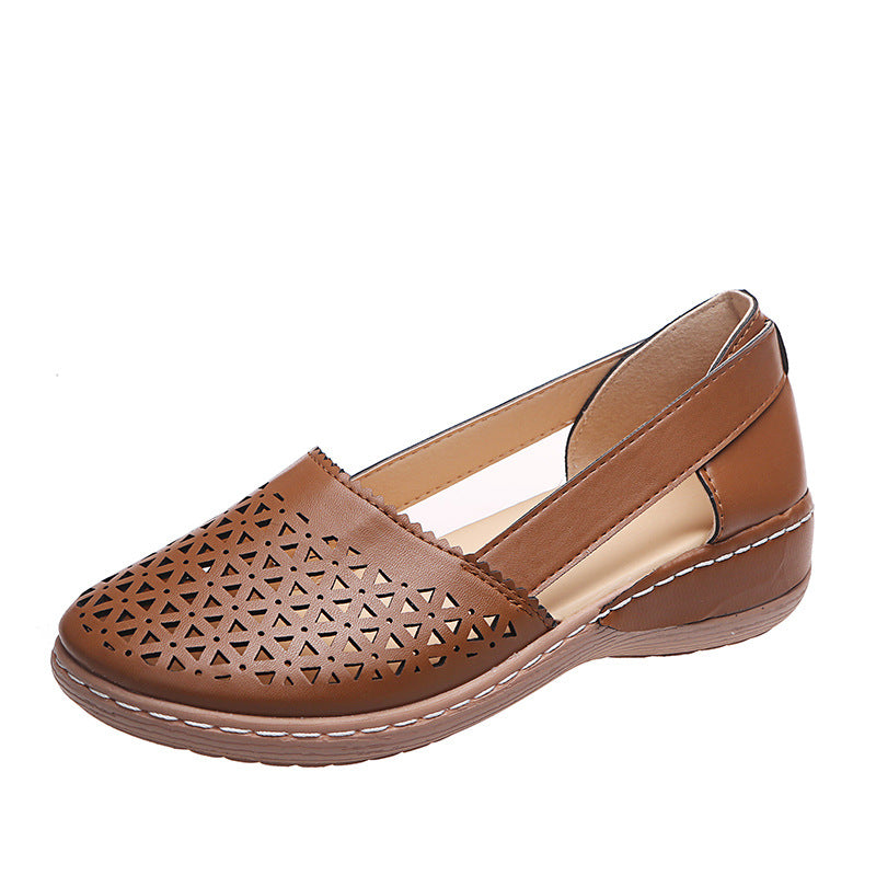 Brown perforated shoe on a white background