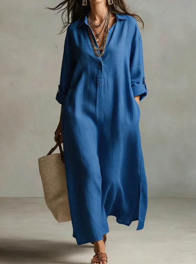 Woman wearing a blue dress holding a straw bag against a neutral background