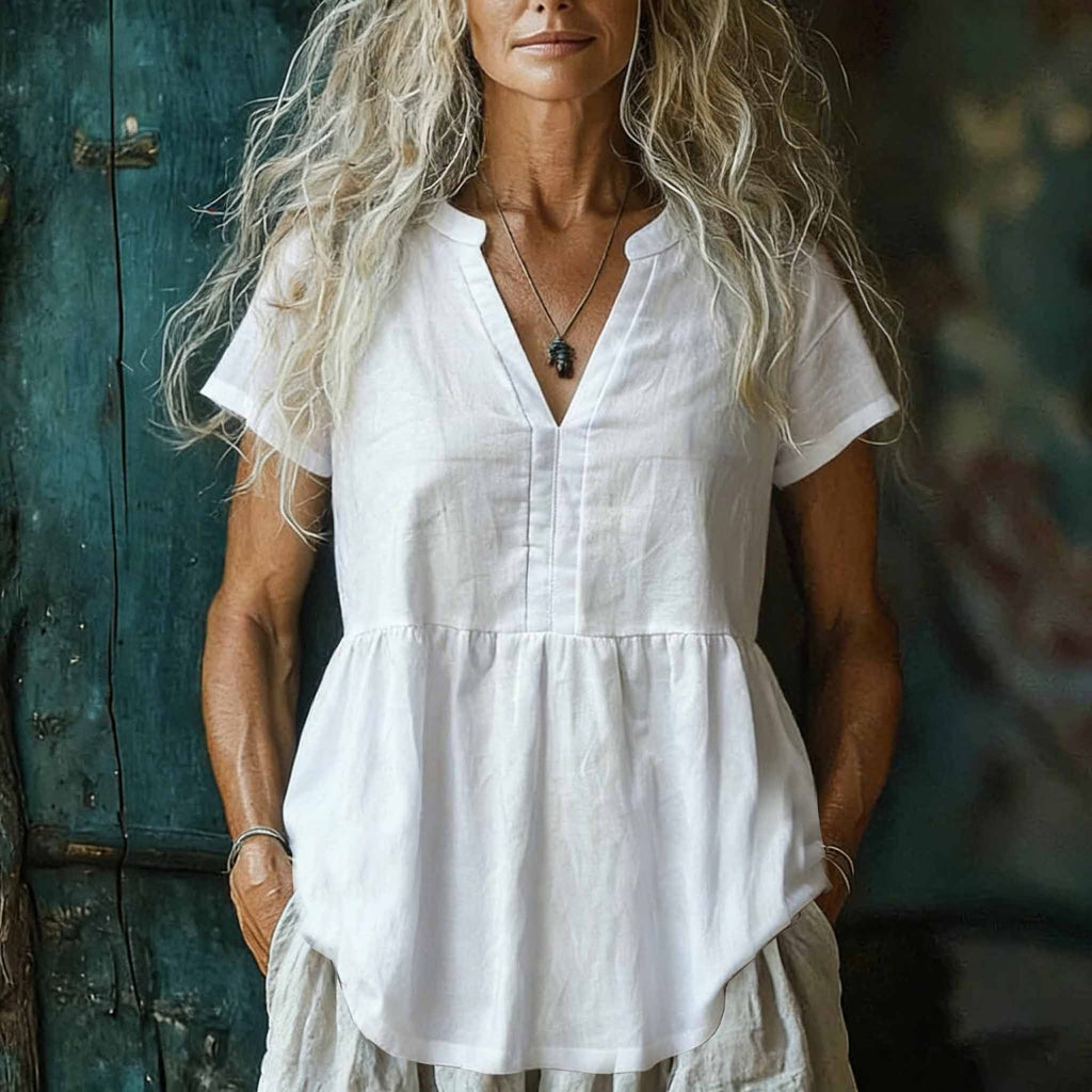 Woman wearing a white dress with a blurred background