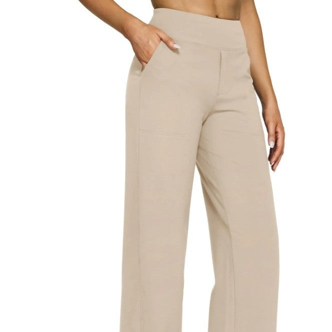 Beige high-waisted pants worn by a person on a white background