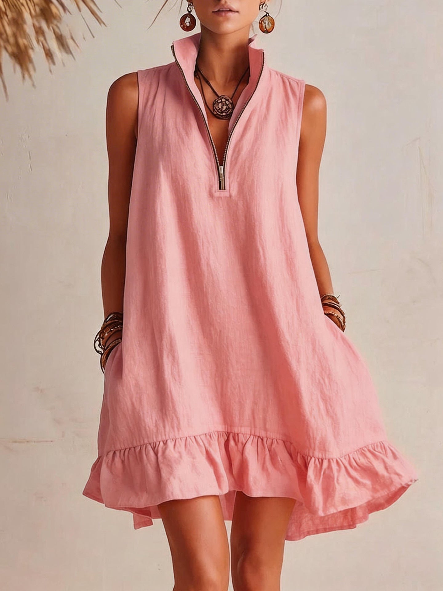 Woman wearing a pink dress with a neutral background