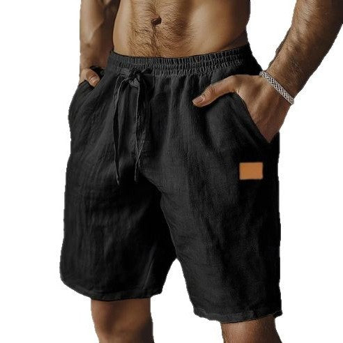 Black shorts with a brown patch on a white background