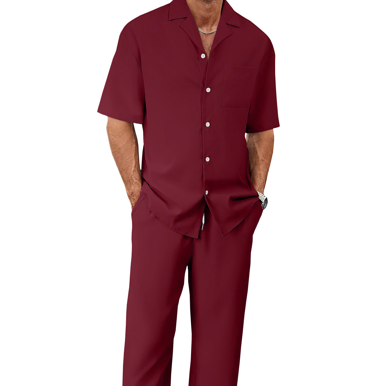 Man wearing a maroon shirt and pants on a white background