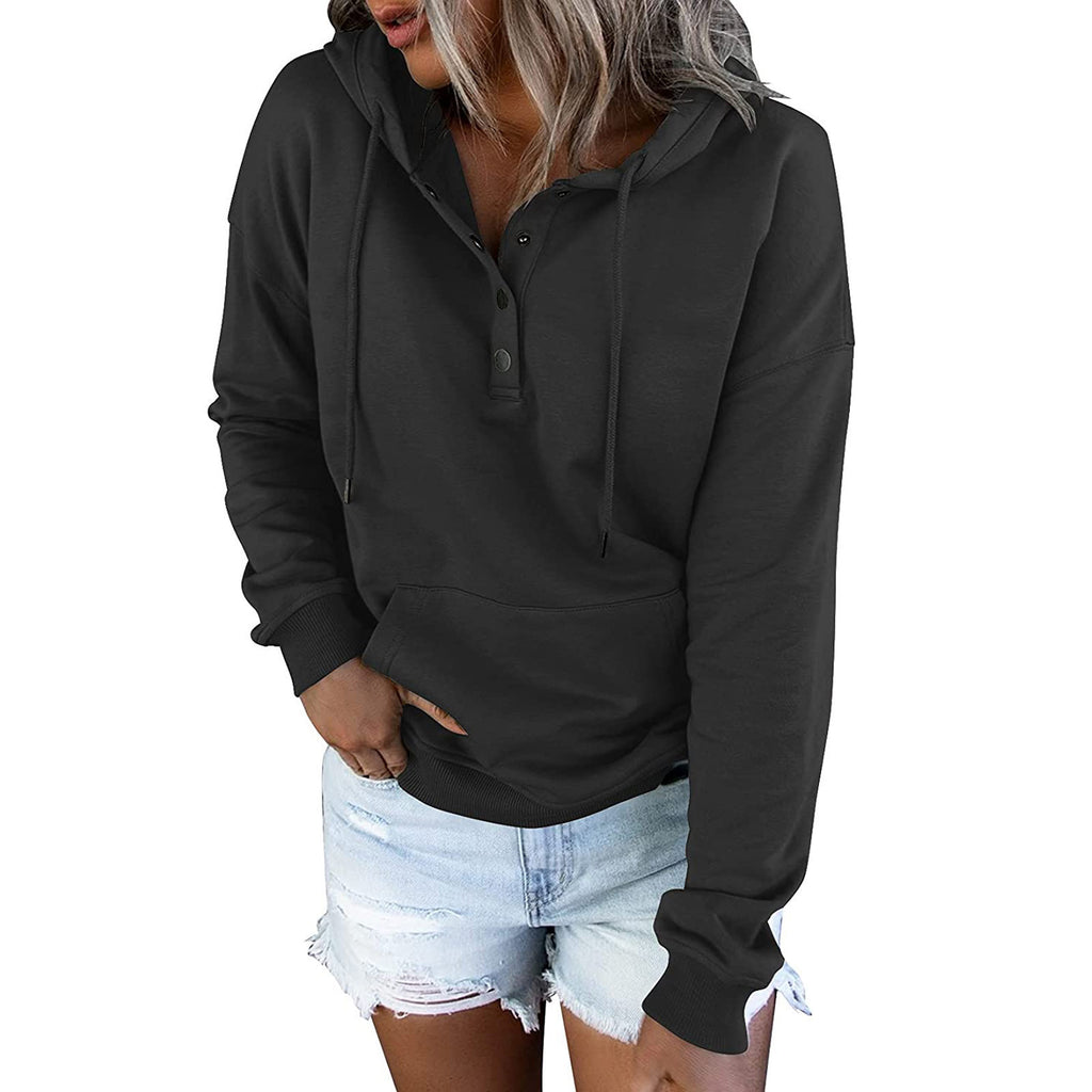 Person wearing a black hoodie and denim shorts on a white background