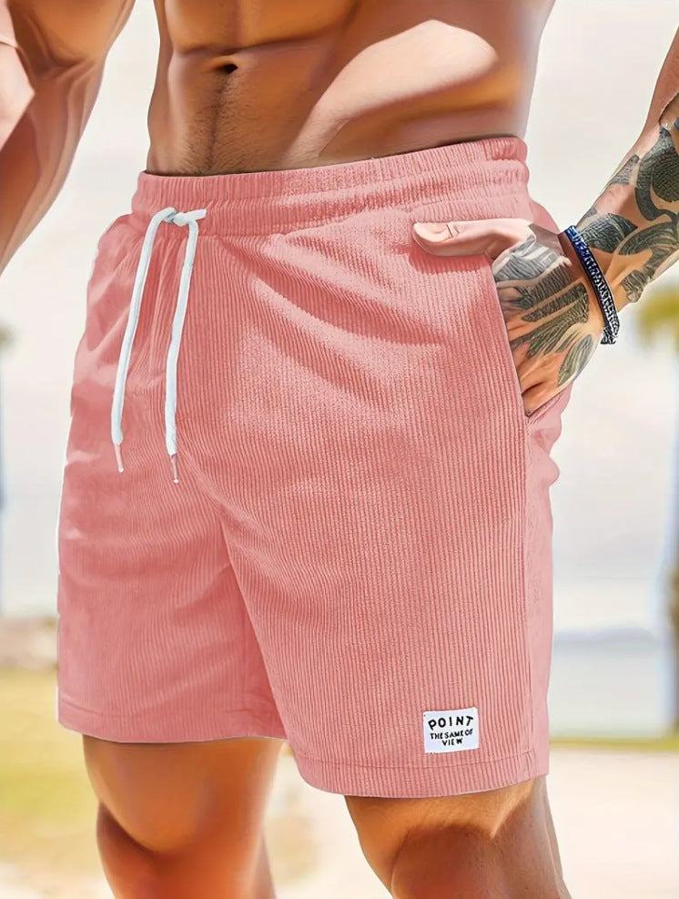 Person wearing pink shorts with a blurred background