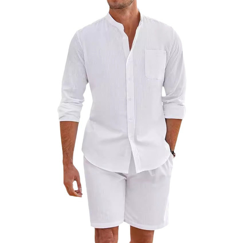 Man wearing a white button-up shirt and shorts on a white background