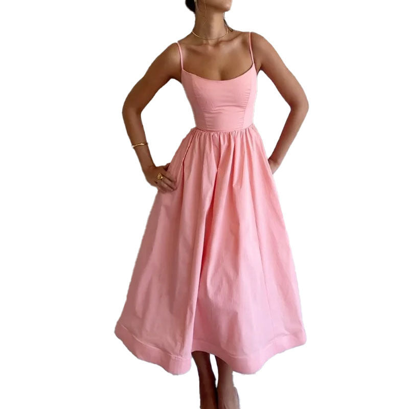 Pink dress worn by a model on a white background