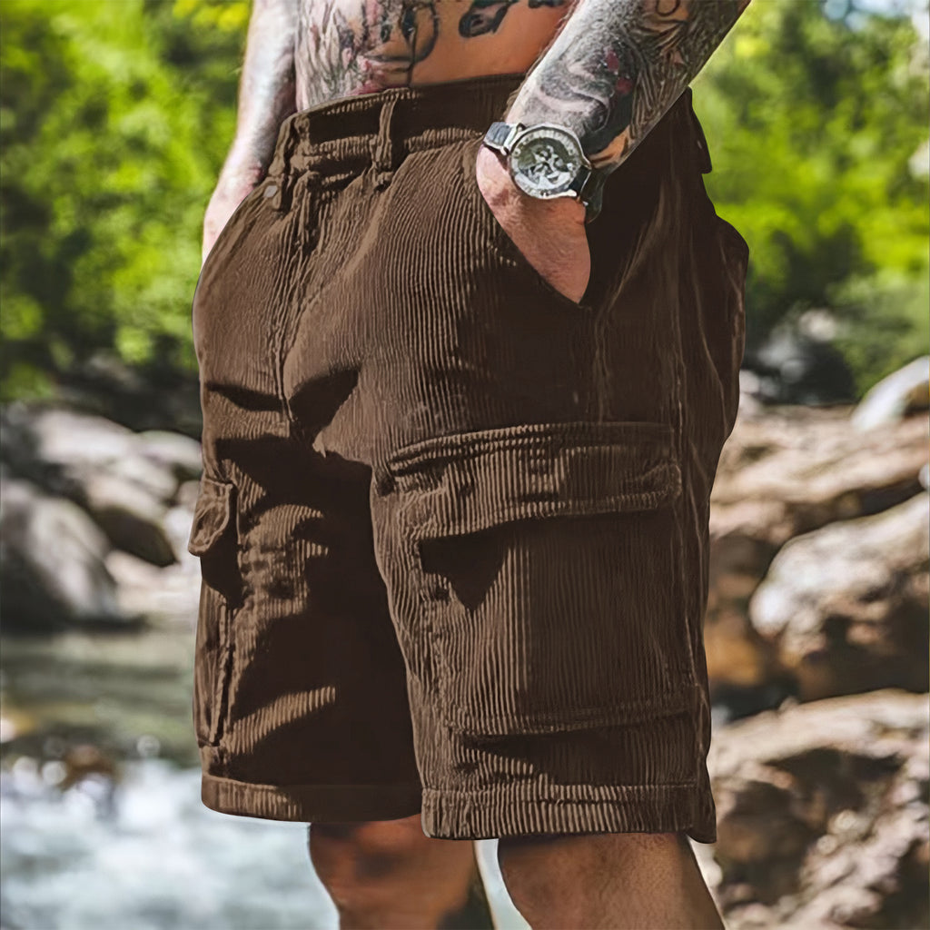 Person wearing brown shorts with a natural background