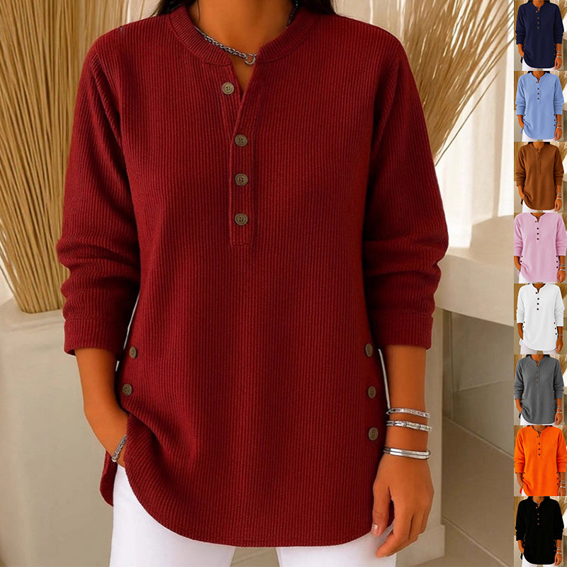 Red ribbed sweater with buttons worn by a person, with color swatches of other sweaters displayed.