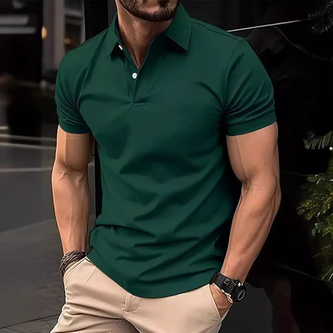 Man wearing a green polo shirt and beige pants in an urban setting