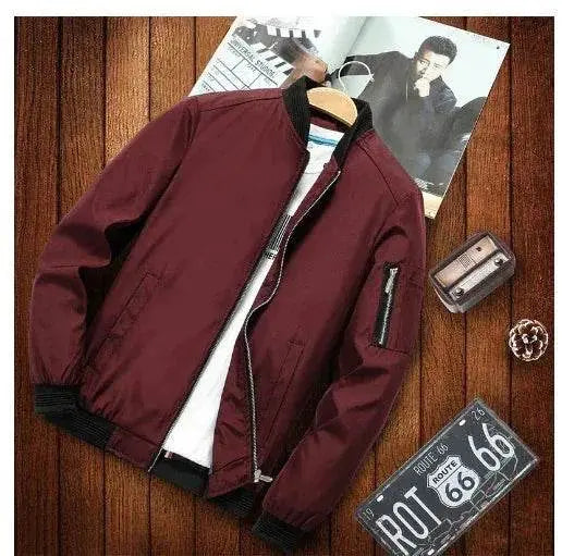 ZA-Zola men’s maroon casual bomber jacket with black trim, displayed flat on a wooden surface