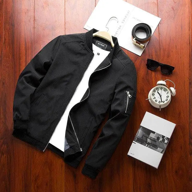 ZA-Zola men's casual black bomber jacket displayed with accessories on wooden floor.