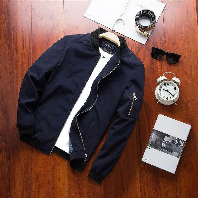 Men’s black casual bomber jacket from ZA-Zola displayed with accessories on wooden floor