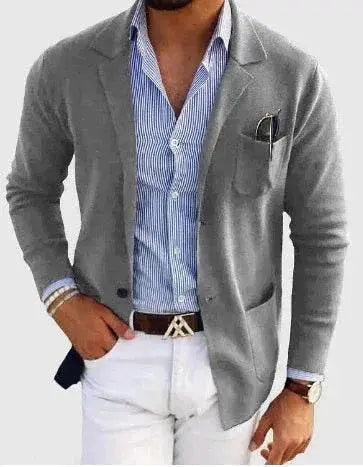 Men's grey double button spring blazer from ZA-Zola, styled with striped shirt and white pants.