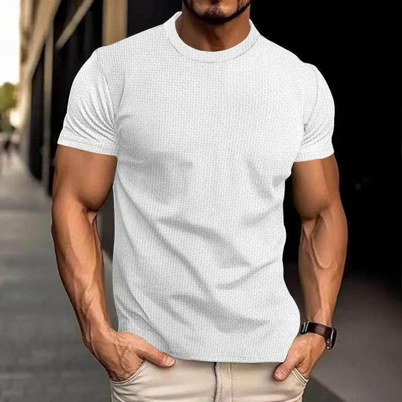 Men's slim-fit white breathable casual top by ZA-Zola, modeled outdoors in daylight.