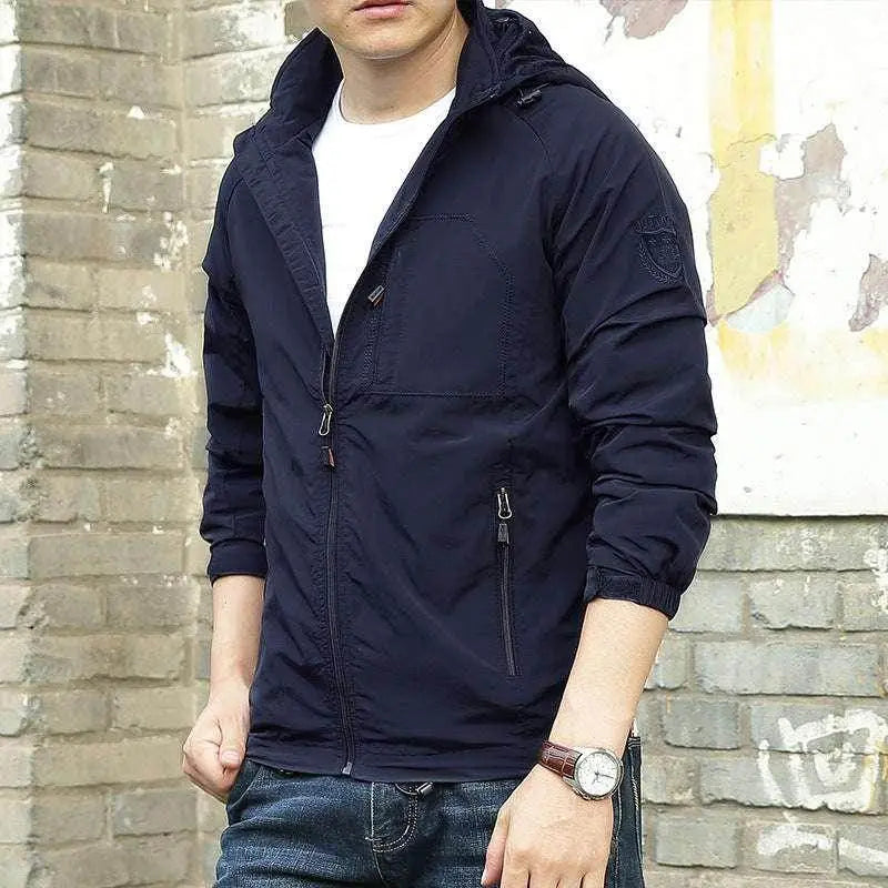 Men's solid navy waterproof outdoor jacket from ZA-Zola, styled with jeans and a white shirt