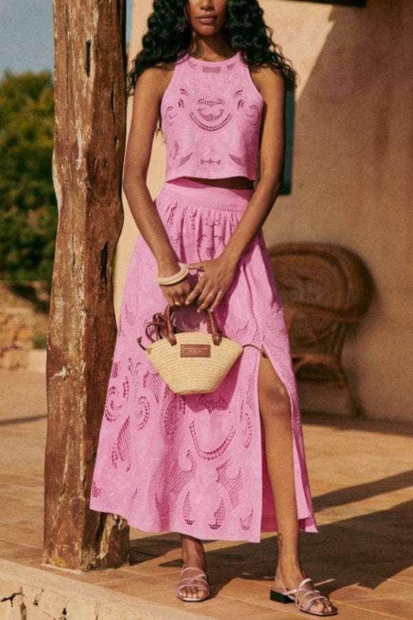 Woman wearing a pink eyelet maxi skirt set, holding a straw handbag, ZA-Zola fashion style