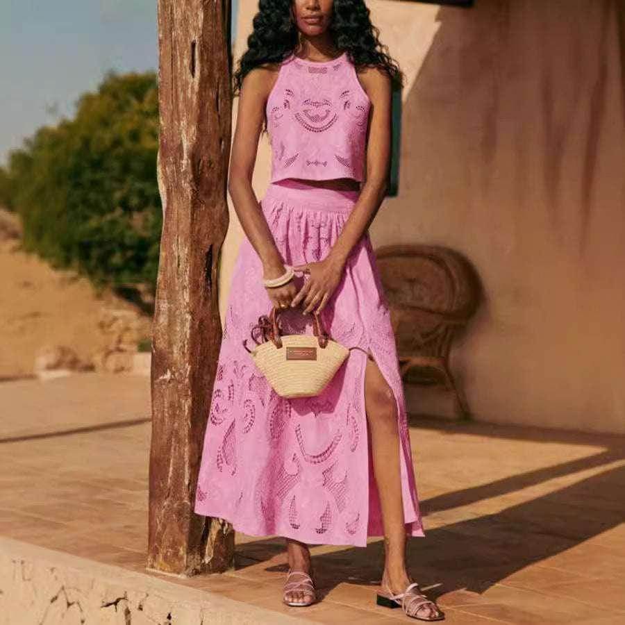 Woman in a pink eyelet skirt set with straw bag, chic summer style from ZA-Zola fashion UK